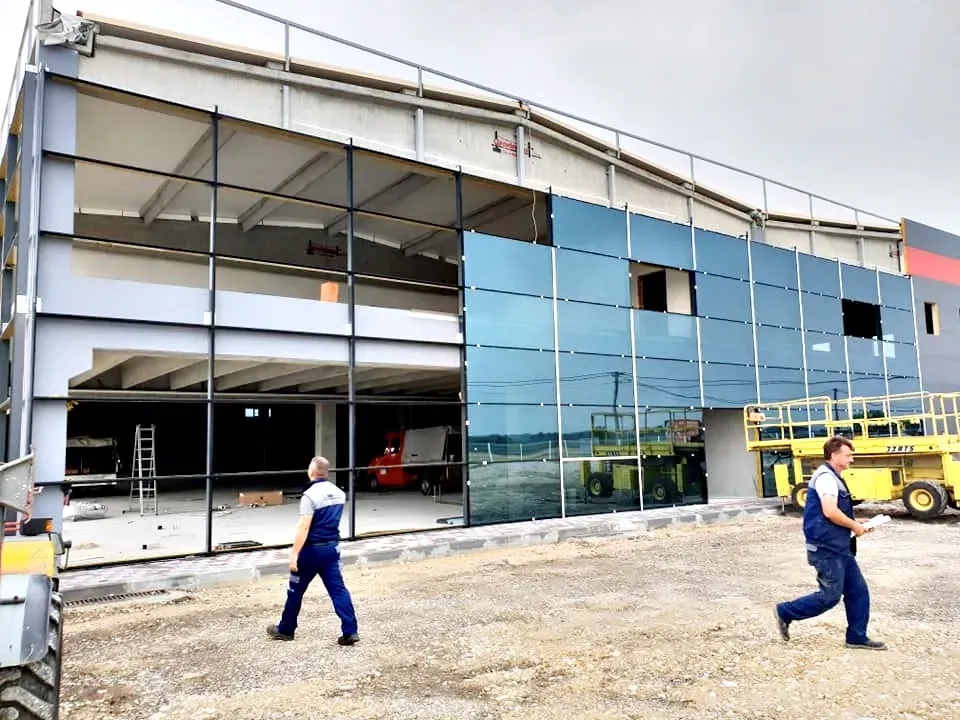 Industrial building with a glass facade and steel substructure