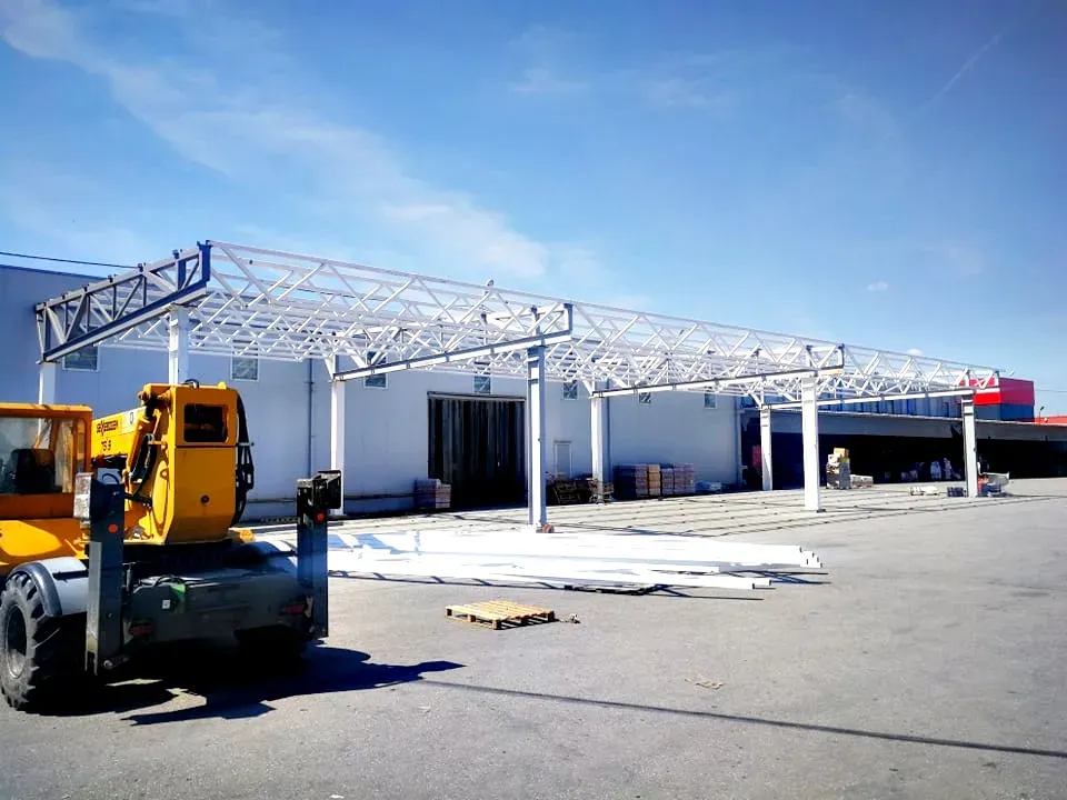 Steel canopy being erected with a mobile crane