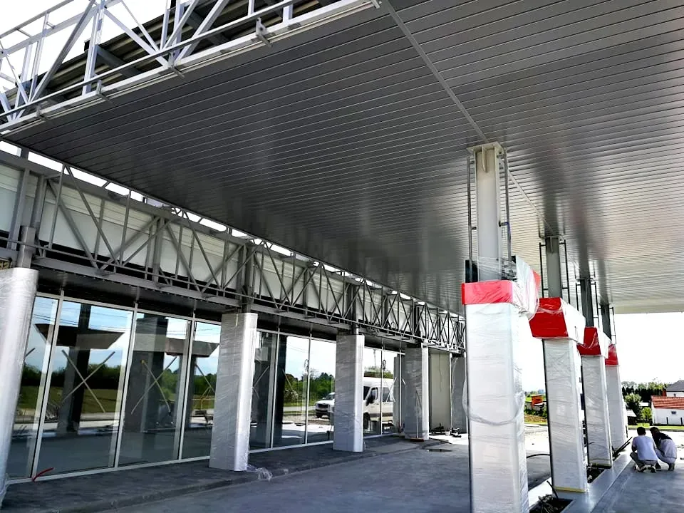 Underside of a service building canopy with steel columns